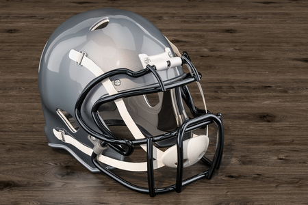 American football helmet on the wooden table 3d rendering