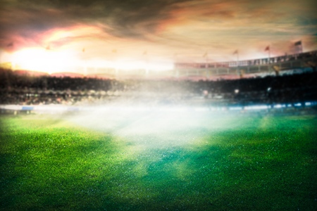 Football soccer match grass close up night event lights on the stadium