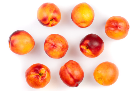 Ripe nectarine with leaves isolated on white background top view flat lay pattern