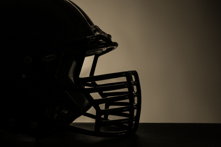 Rugby helmets on dark background Stock Photo