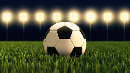 Soccer ball illuminated football stadium Stock Photo