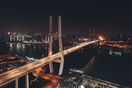 Shanghai nanpu bridge over huangpu river with busy traffic in china