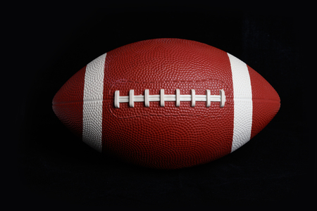 American football isolated on black close up Stock Photo