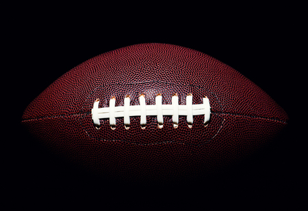 American football ball isolated on black background