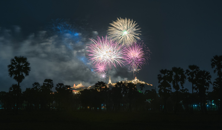 Annual festival of khao wang temple with colorful fireworks on hill at night phetchaburi thailand