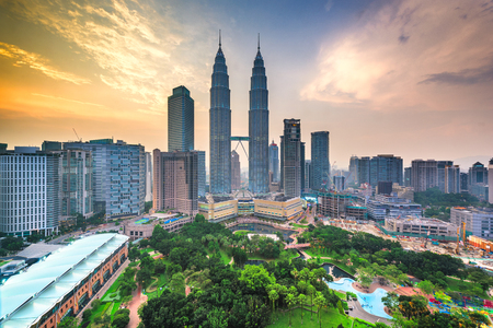 Kuala lumpur malaysia park and skyline at dusk