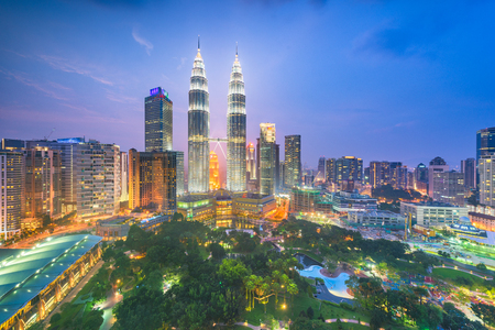 Kuala lumpur malaysia park and skyline at dusk Stock Photo