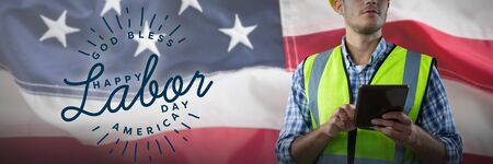 Concentrated construction worker with tablet against full frame of american flag usa labor day concept advertisement usa labor day concept advertisement