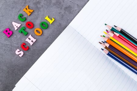 The layout of school supplies on a dark gray background the view from the top back to school flat lay