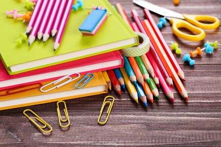 School supplies on brown wooden table