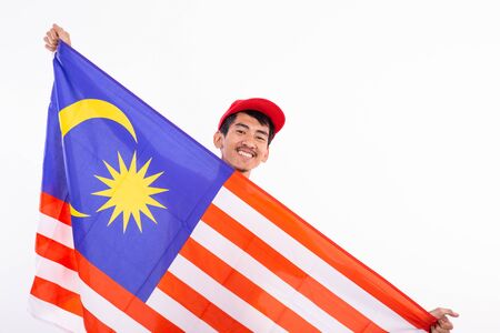 Asian young male holding malaysia flag