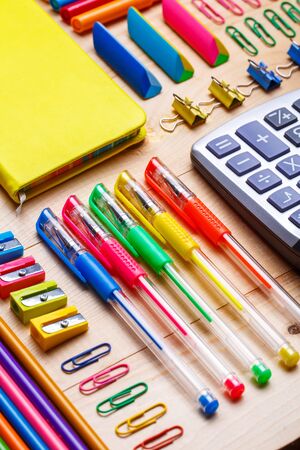 Group of school supplies and notebooks on wooden table working place elements flat lay Stock Photo