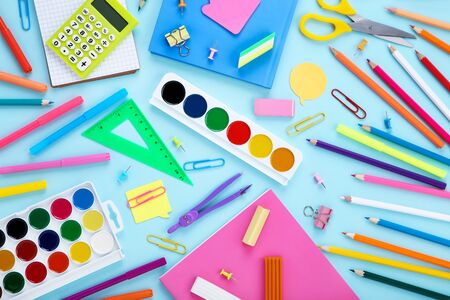 Different school supplies on blue Stock Photo