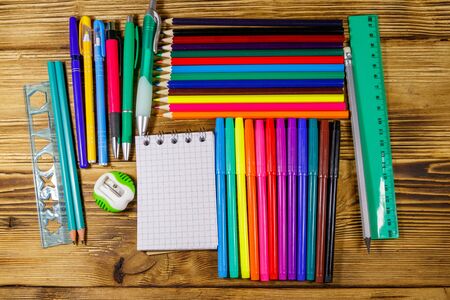 Set of school stationery supplies on a wooden desk back to school concept