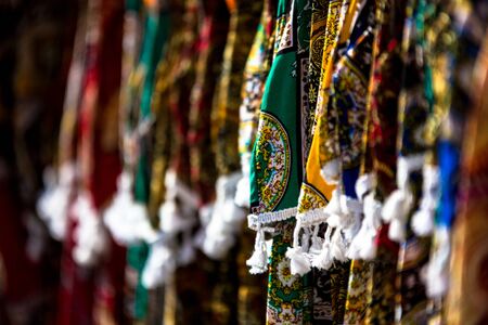 Vendor stall selling colorful handmade fabric in sunday marhet in bac ha near lao cai sapa north of vietnam Stock Photo