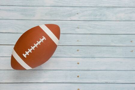 American football ball on wooden background Stock Photo