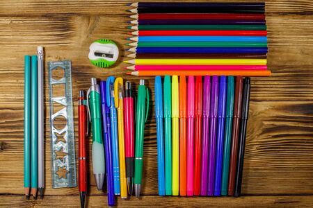 Set of school stationery supplies on a wooden desk back to school concept