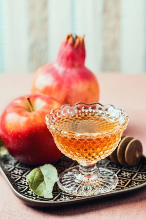 Rosh hashanah jewish holiday concept honey apple and pomegranate