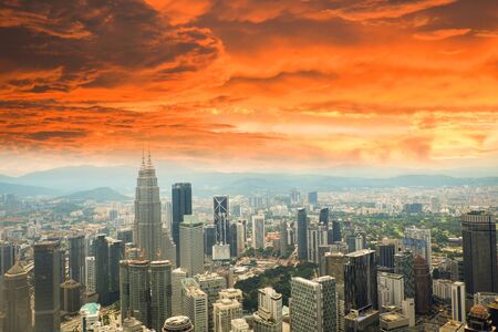 Kuala lumpur city landscape view of skyline top view cityscape at malaysia asian red cloud orange on the city global warming storm sky dramatic dust in the city smoke concept Stock Photo