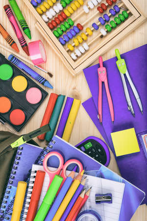 Back to school school supplies flat lay on wood background top view children creative and education concept