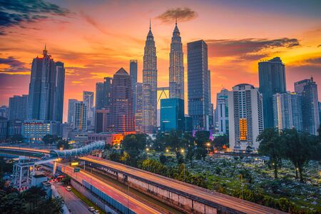 Cityscape of kuala lumpur city skyline at sunrise in malaysia