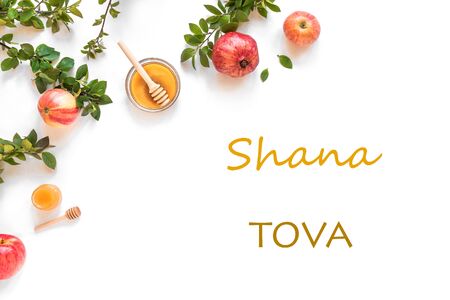 Rosh hashanah jewish new year holiday concept creative layout of traditional symbols apples honey pomegranate isolated on white top view copy space