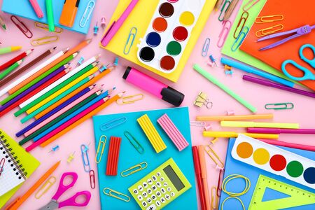 Different school supplies on pink background Stock Photo