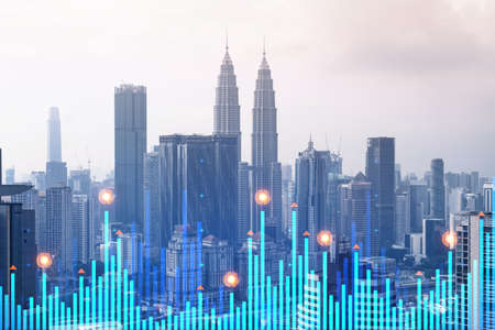 Financial stock chart hologram over panorama city view of kuala lumpur kl is the business center in malaysia asia the concept of international transactions double exposure Stock Photo