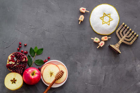 Jewish cuisine for rosh hashana holiday apple honey and pomegranate top view