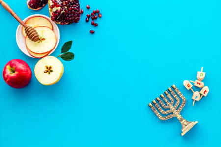 Jewish cuisine for rosh hashana holiday apple honey and pomegranate top view