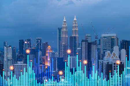 Stock market graph hologram night panorama city view of kuala lumpur kl is popular location to gain financial education in malaysia asia the concept of international research double exposure