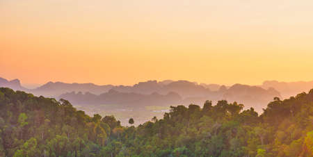 Beautiful tropical landscape with mountain rainforest and steep rocky ridge at horizon at sunset krabi thailand Stock Photo