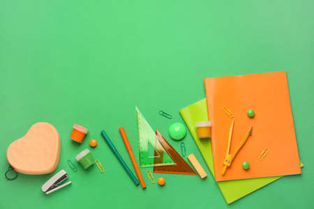 Set of school supplies on color background