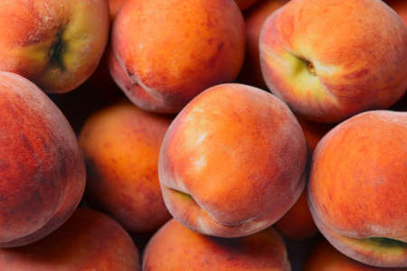 Many ripe peaches as background Stock Photo