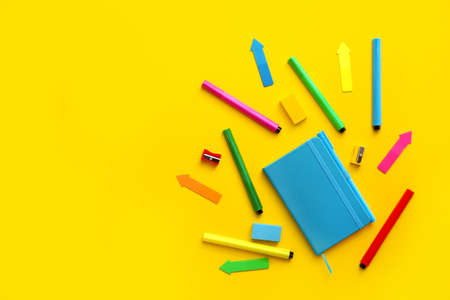 Set of school supplies on color background