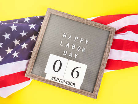 Happy labor day greetings on letter board with american flag Stock Photo