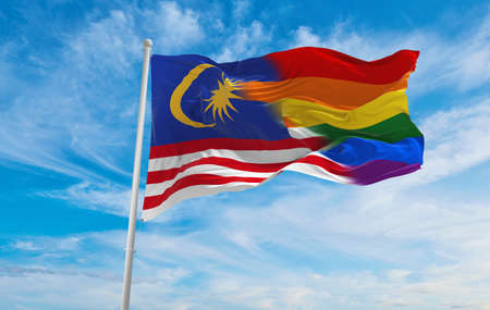 National flag of malaysia flag waving in the wind at cloudy sky freedom and love concept pride month activism community and freedom concept copy space 3d illustration