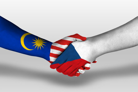 Handshake between czech republic and malaysia flags painted on hands illustration Stock Photo