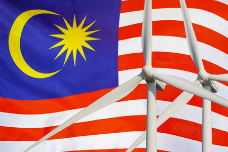 Two wind turbines for alternative energy on malaysia flag background energy development and energy crisis eco power and wind stations for renewable electric energy production in malaysia