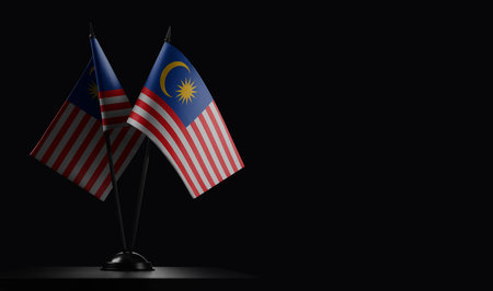 Small national flags of the malaysia on a black background