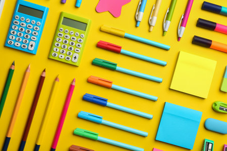 Flat lay composition with school stationery on yellow background back to school Stock Photo