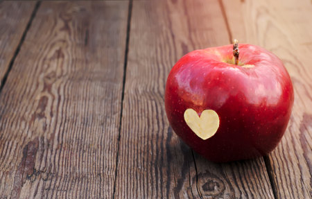 Apple with a symbol heart