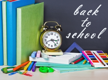 Inscription on the chalkboard back to school and supplies for school Stock Photo