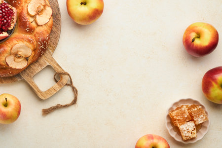 Jewish holidays rosh hashanah or rosh hashanah pomegranate apples honey and round challah on rustic gray table background jewish autumn celebration shana tova yom kippur concept top view Stock Photo