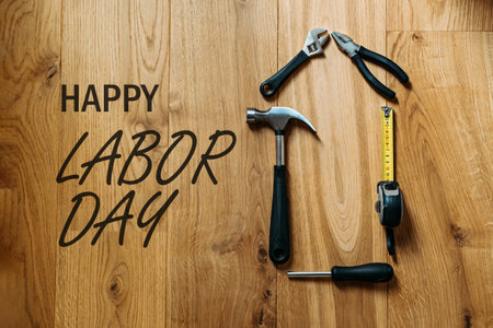 Happy labor day banner with different construction tools on wooden background construction and manufacturing tools on wooden background labor day background concept