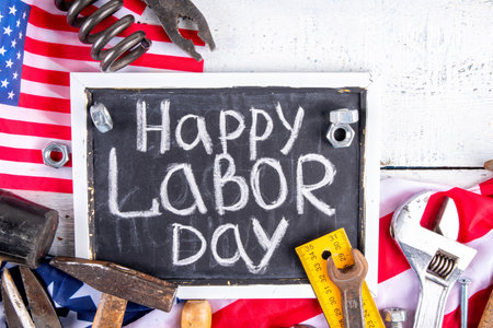 American national patriotic workers happy labor day holiday background construction and manufacturing tools on wooden background with stars red white blue striped us flag