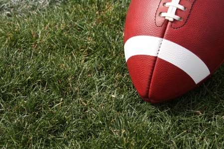 American football close up on the grass with room for copy Stock Photo