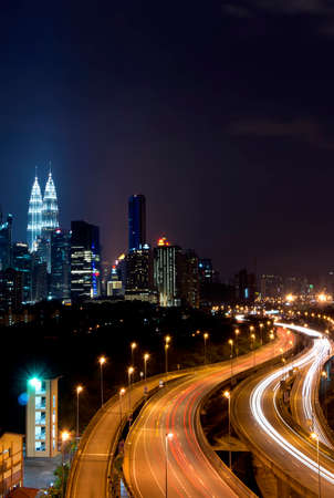 Stunning light trail scenery at the busy highway with the view of kuala lumpur city Stock Photo