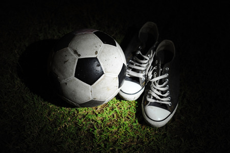 Sneakers with a soccer ball light painting