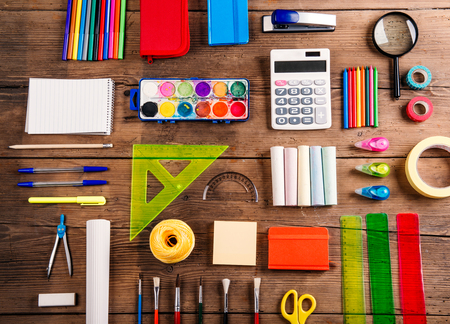 Desk with stationary studio shot on wooden background Stock Photo